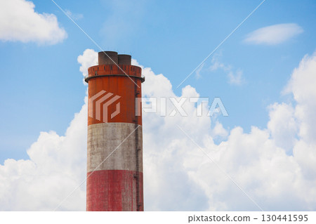High smoke stack chimney low carbon emission against blue sky, Green Industry zone saving ecology industrial. 130441595
