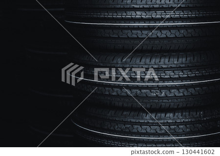 Car Tyre vehicle tires , black new shiny car tire stacked with copy space for garage car wheel background Car Tyre vehicle tires , black new shiny car tire stacked with copy space for garage car wheel background 130441602