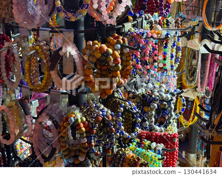 Colorful bead bracelets on market stand. Fashion, craft, and handmade accessories for personal style. Colorful bead bracelets on market stand. Fashion, craft, and handmade accessories for personal style. 130441634