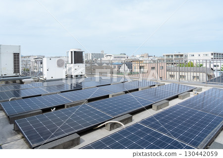 Solar panels installed on the roof of a building 130442059