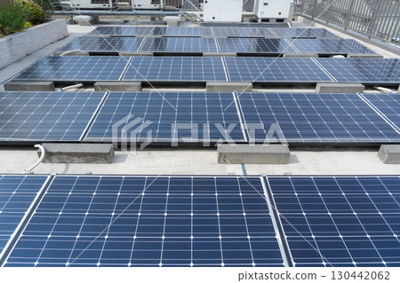 Solar panels installed on the roof of a building 130442062