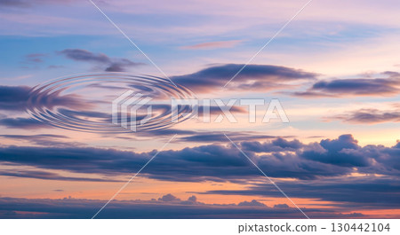Fantasy background concept showing dramatic sunset sky with water ripple, surreal evening cloudscape with mysterious liquid motion for abstract wallpaper or creative art 130442104