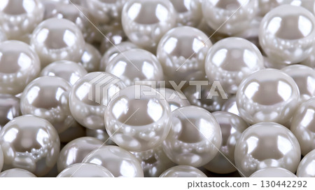 Natural pearls clustered together on a soft background for a timeless, elegant display Natural pearls clustered together on a soft background for a timeless, elegant display 130442292