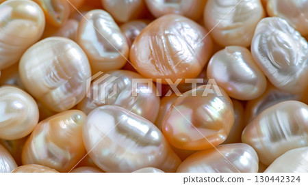 Natural pearls displayed on a soft pearl background showcasing unique shapes and luster 130442324
