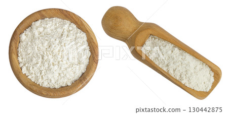 White flour in wooden bowl and scoop isolated on white background. Top view. Flat lay. 130442875