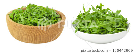 Heap of green fresh rucola or arugula leaf in wooden and ceramic bowl isolated on white background 130442909