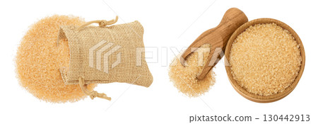 The brown sugar in a bag and wooden bowl isolated on white background. Top view, flat lay 130442913