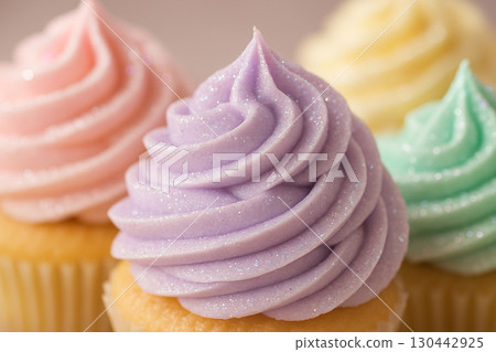 Cupcake with large swirl of bright pink frosting standing out against soft neutral backdrop Cupcake with large swirl of bright pink frosting standing out against soft neutral backdrop 130442925
