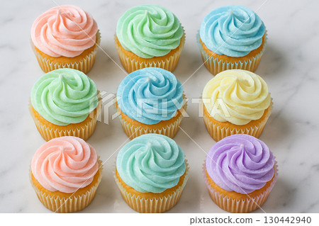 Nine pastel cupcakes with swirled frosting in bright colors presented in neat square grid Nine pastel cupcakes with swirled frosting in bright colors presented in neat square grid 130442940