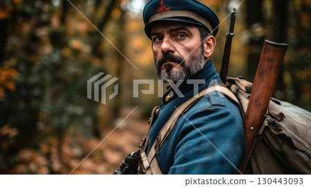 A soldier gazes into the distance with determination. The autumn forest surrounds him, evoking a sense of history and bravery. Nature and conflict intertwine. Generative AI 130443093