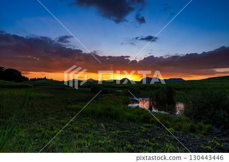 Evening view of the Soni Plateau in early autumn 2025. The golden sunset remaining on the mountainside and the sky reflected on the surface of the Okame Pond. Evening view of the Soni Plateau in early autumn 2025. The golden sunset remaining on the mountainside and the sky reflected on the surface of the Okame Pond. 130443446