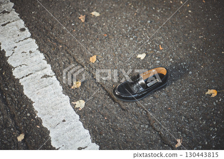 A loafer that fell in the parking lot A loafer that fell in the parking lot 130443815