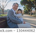 Happy grandfather with grandson on his lap 130444062