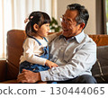 Happy grandfather with grandson on his lap 130444065