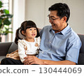 Happy grandfather with grandson on his lap 130444069