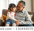 Happy grandfather with grandson on his lap 130444070