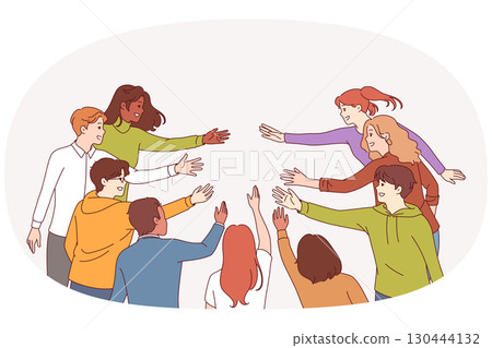 Multicultural people reach out to each other, demonstrating unity and readiness to create community 130444132