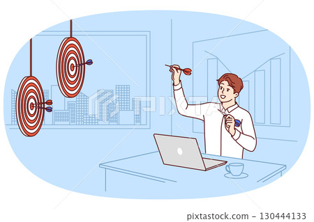 Business man achieving marketing goals, sitting at office desk and playing darts 130444133