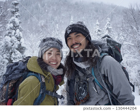Men and women smiling on snowy mountains | Winter mountain climbing, outdoor, travel image Men and women smiling on snowy mountains | Winter mountain climbing, outdoor, travel image 130444204