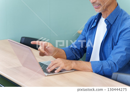 Senior men using laptops 130444275