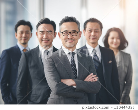 Confident businessmen and women in the office | Team, smiling 130444355