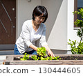 A woman enjoying a family garden 130444605