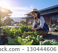 A woman enjoying a family garden 130444606