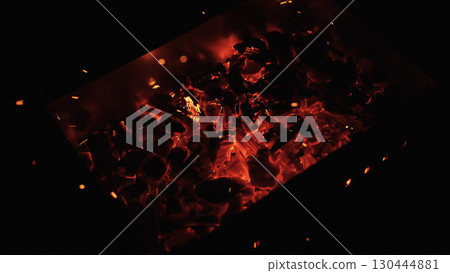 closeup of hot charcoal in dark environment 130444881