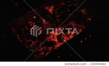 closeup of hot charcoal in dark environment 130444882