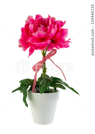 A detailed studio shot of a lush artificial pink flower in a white pot on a white background A detailed studio shot of a lush artificial pink flower in a white pot on a white background 130446138
