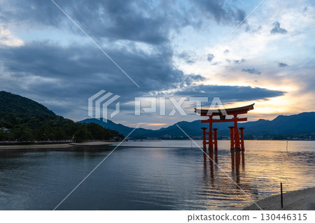 Famous red torii gate of Itsukushima shrine at sunset in Miyajima, Japan Famous red torii gate of Itsukushima shrine at sunset in Miyajima, Japan 130446315