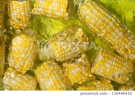 Aesthetic summer bright background of fresh ripe corn cob in water. Aesthetic summer bright background of fresh ripe corn cob in water. 130446430