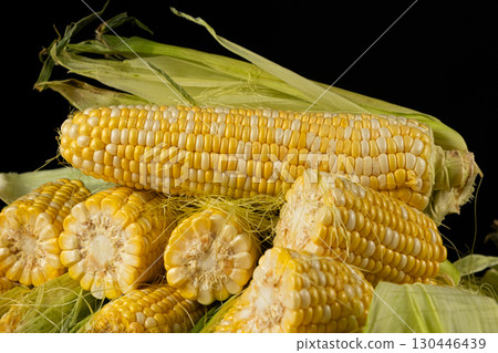Close-up view of fresh raw corn cobs ready for cooking. Close-up view of fresh raw corn cobs ready for cooking. 130446439