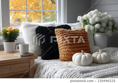 Cozy Autumn Interior with Warm Textiles, Pumpkins, and Flowers by the Window Generative AI 130446528