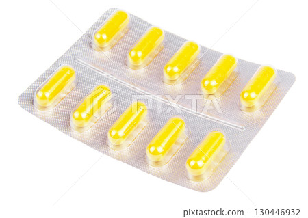 Yellow pills in the blister pack, isolated on white Yellow pills in the blister pack, isolated on white 130446932