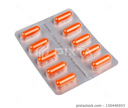 Yellow pills in the blister pack, isolated on white 130446933