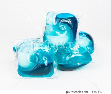 Capsules for washing laundry detergents for washing clothes in a washing machine isolated on a white background. Capsules for washing laundry detergents for washing clothes in a washing machine isolated on a white background. 130447199