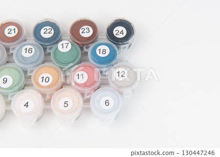 Drawing a picture by numbers with acrylic paints on canvas 130447246