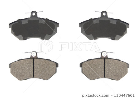 Auto brake pads isolated on white background. Set of brake pads. New auto spare parts isolated on white background Auto brake pads isolated on white background. Set of brake pads. New auto spare parts isolated on white background 130447601