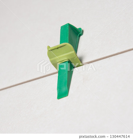 Tile leveling system with plastic clips and wedges Tile leveling system with plastic clips and wedges 130447614
