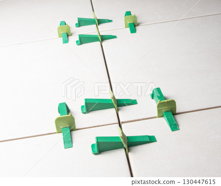Tile leveling system with plastic clips and wedges Tile leveling system with plastic clips and wedges 130447615