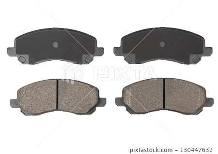 Auto brake pads isolated on white background. Set of brake pads. New auto spare parts isolated on white background 130447632
