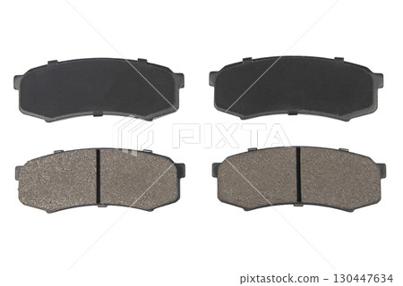Auto brake pads isolated on white background. Set of brake pads. New auto spare parts isolated on white background 130447634