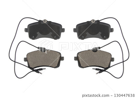 Auto brake pads isolated on white background. Set of brake pads. New auto spare parts isolated on white background Auto brake pads isolated on white background. Set of brake pads. New auto spare parts isolated on white background 130447638