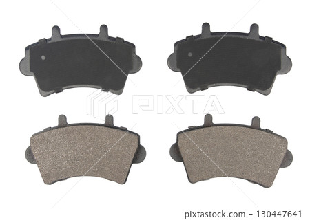 Auto brake pads isolated on white background. Set of brake pads. New auto spare parts isolated on white background Auto brake pads isolated on white background. Set of brake pads. New auto spare parts isolated on white background 130447641