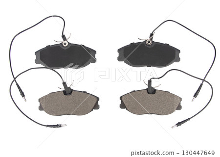 Auto brake pads isolated on white background. Set of brake pads. New auto spare parts isolated on white background 130447649