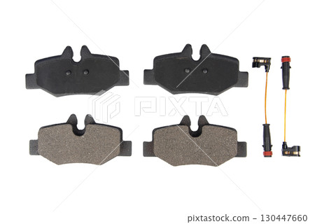Auto brake pads isolated on white background. Set of brake pads. New auto spare parts isolated on white background Auto brake pads isolated on white background. Set of brake pads. New auto spare parts isolated on white background 130447660