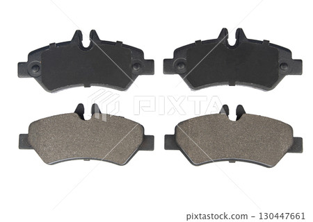 Auto brake pads isolated on white background. Set of brake pads. New auto spare parts isolated on white background Auto brake pads isolated on white background. Set of brake pads. New auto spare parts isolated on white background 130447661