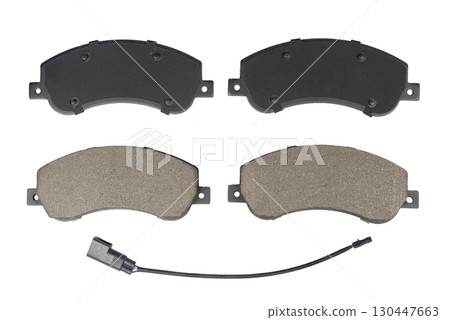 Auto brake pads isolated on white background. Set of brake pads. New auto spare parts isolated on white background 130447663