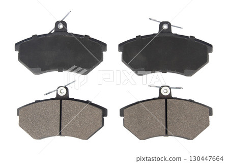 Auto brake pads isolated on white background. Set of brake pads. New auto spare parts isolated on white background 130447664